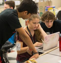 students with laptop